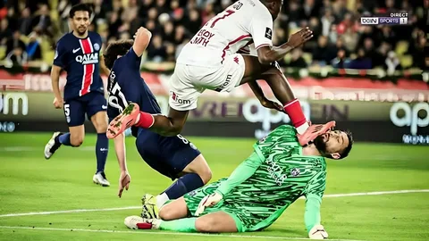 A football player receiving medical attention on the field after sustaining an injury during a game